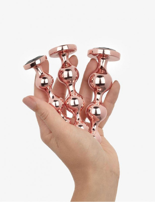 3 plugs metálicos oro rosado